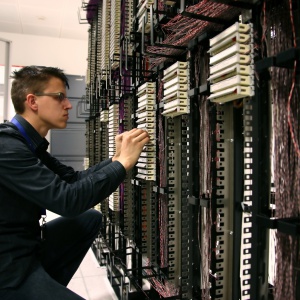 man repairing server